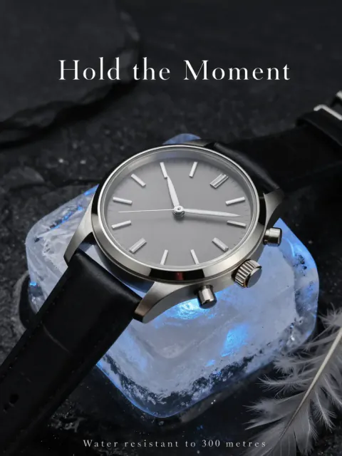The frozen watch shot laid out as a print ad, with the headline “Hold the Moment” and a line reading “Water resistant to 300 metres”.