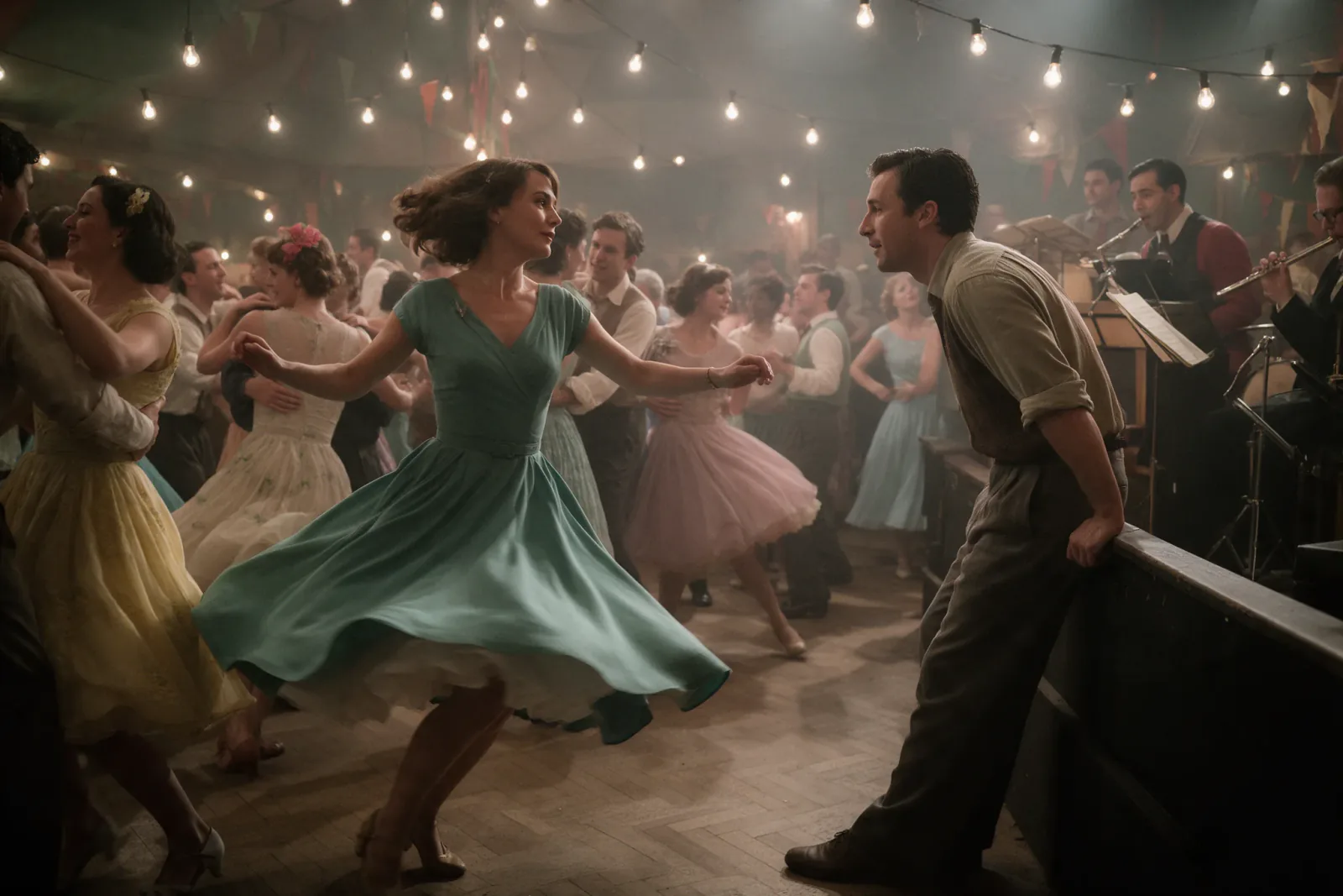 A woman in a sea-green dress spins on a crowded 1950s dance floor while a man by the bandstand watches her.